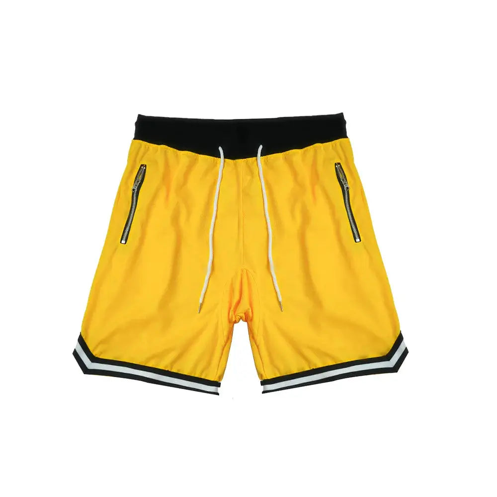 Men's yellow basketball shorts with black waistband, white drawstrings, zip pockets, and black-white striped hem.