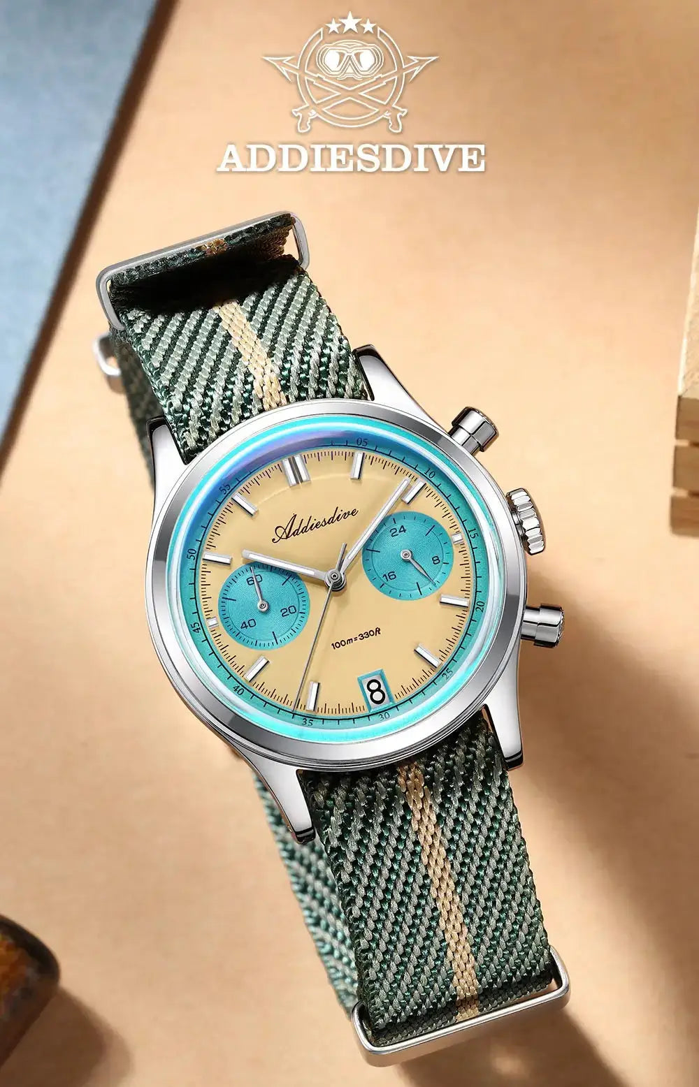 Addiesdive chronograph wristwatch; beige dial, blue subdials, teal bezel, green striped NATO strap