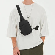 2-in-1 waist bag chest bag in black by Simples Market, worn as a crossbody.
