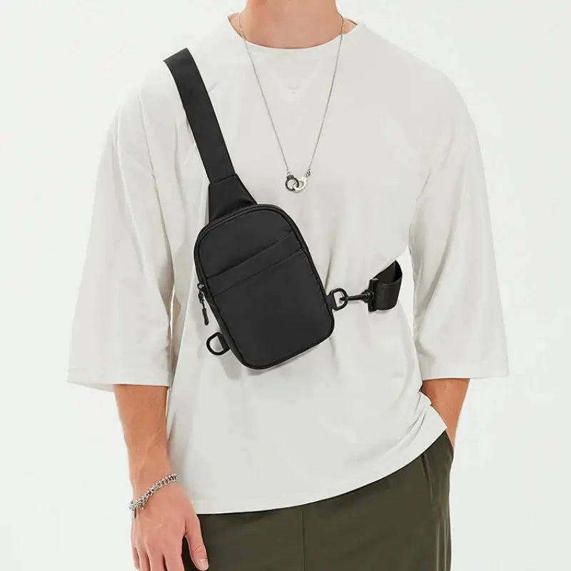2-in-1 waist bag chest bag in black by Simples Market, worn as a crossbody.
