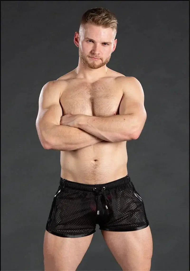 Men's black mesh gym shorts with drawstring, breathable quick-dry fabric.