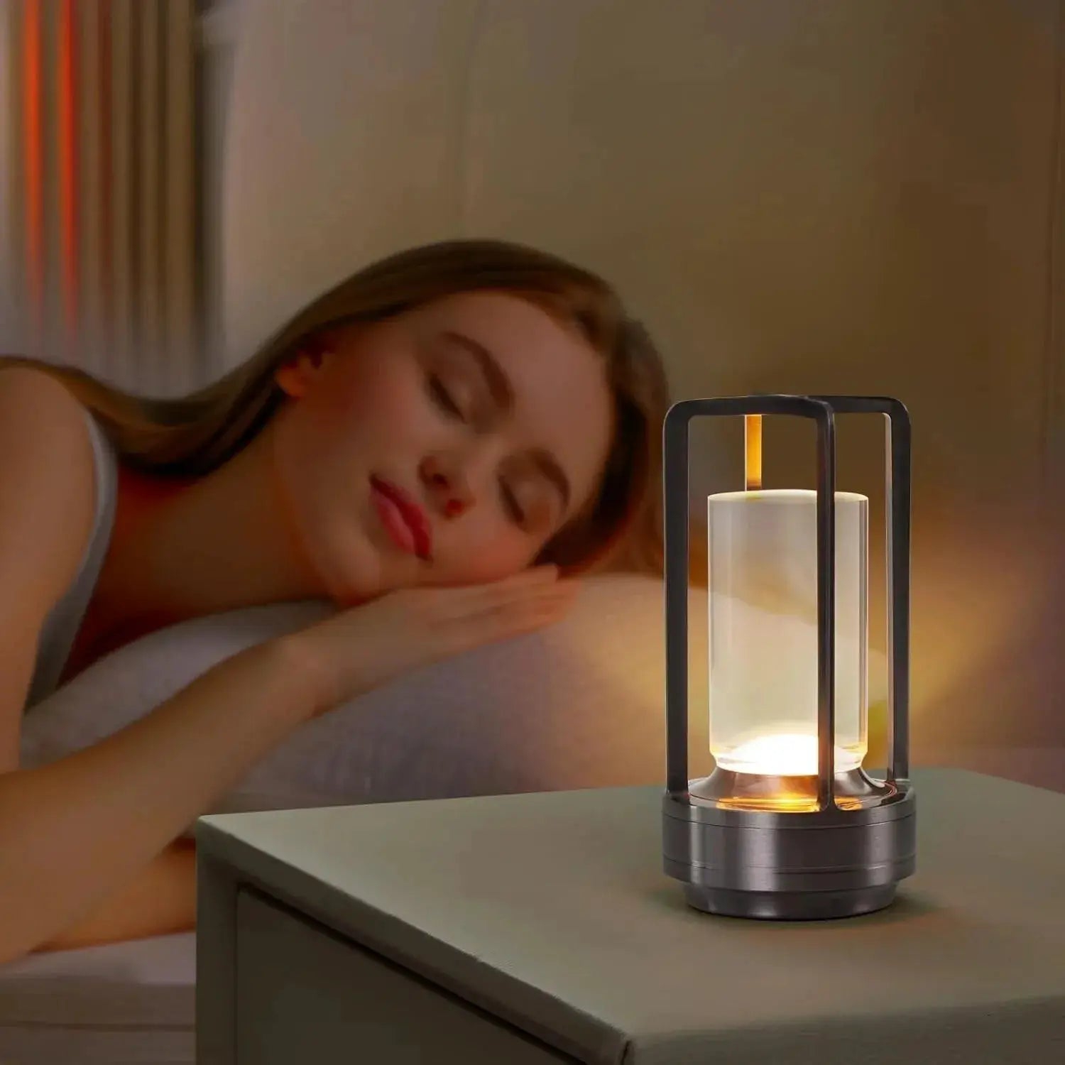 GGbingo cordless LED table lamp with black metal frame and glass cylindrical shade, rechargeable, ideal for bedside use.