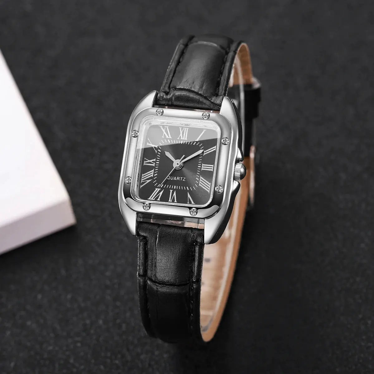 Fashion square women's quartz watch with black leather strap, silver case, Roman numeral dial