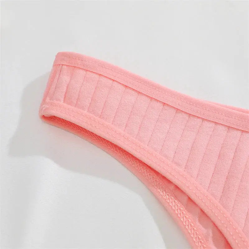 Pink cotton striped thong waistband close-up showing ribbed fabric and stitching