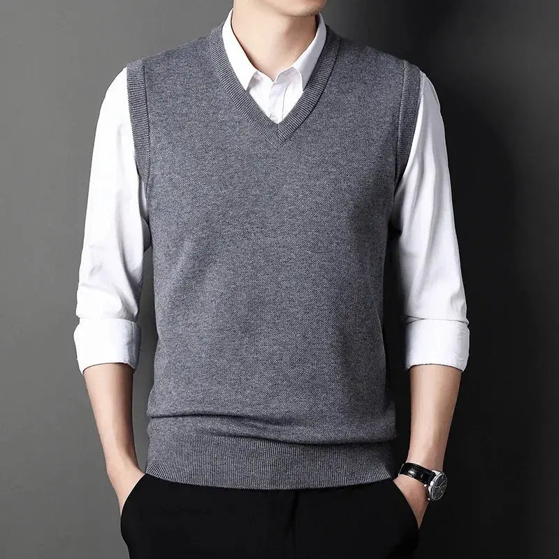Men's gray V-neck knitted vest by Simples Market, layered over a white shirt.