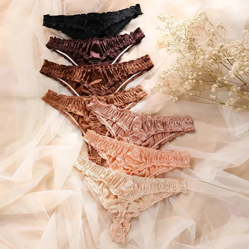 7-piece satin ice-silk seamless panties set with frill trim, no-show design; colors black, burgundy, brown, pink, peach, nude