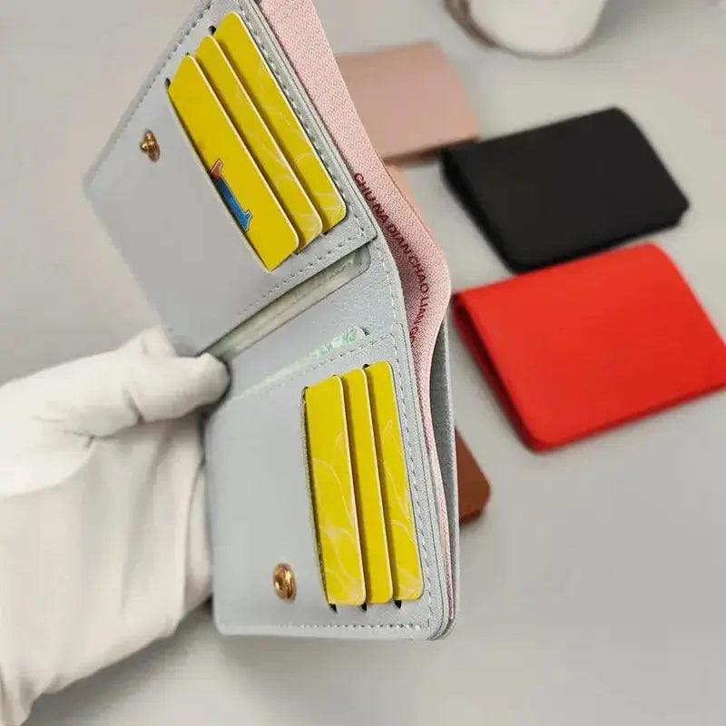 Small wallet by Simples Market, PU leather gray exterior with yellow card slots, ultra-thin bi-fold.