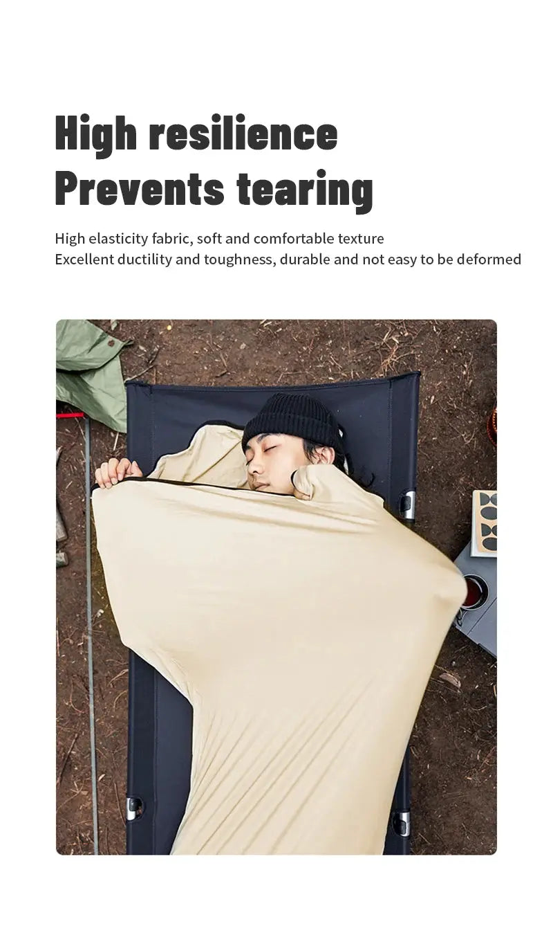 Sleeping bag liner in beige; Naturehike wearable mummy quilt shown worn by a camper outdoors.