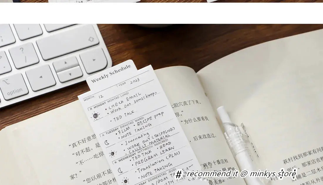 MINKYS 24-sheet kawaii bookmark-type memo pad, white weekly planner and to-do journal on a desk beside a keyboard.