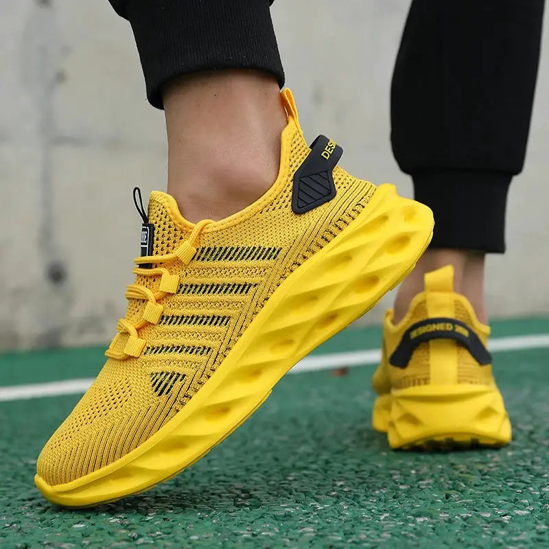 Unisex yellow running sneakers by Simples Market, breathable knit upper pair
