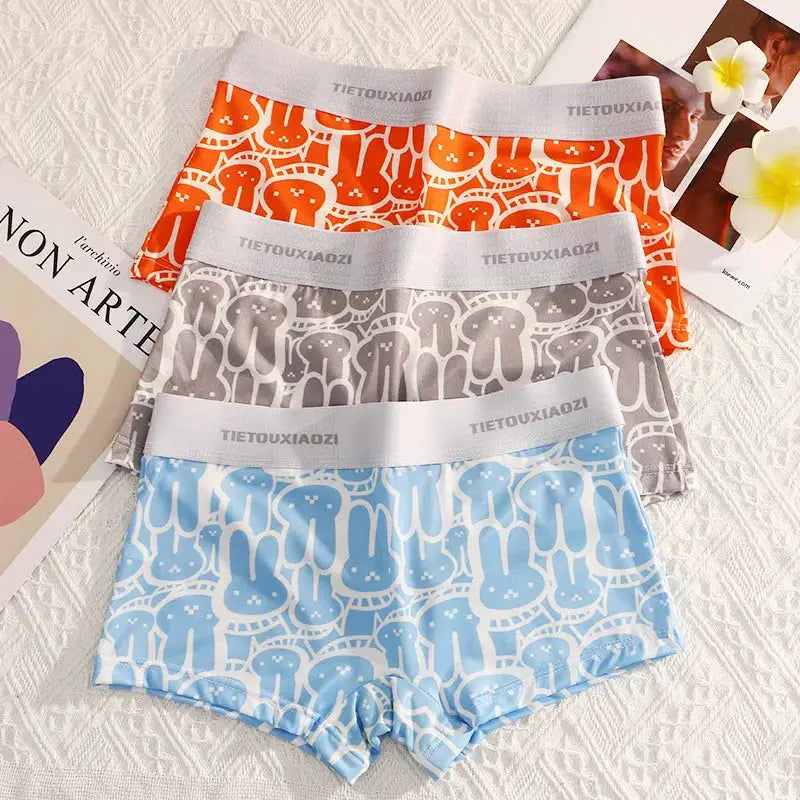 Three pairs of women's seamless breathable boyshorts underwear in orange, gray, and blue with white waistbands.