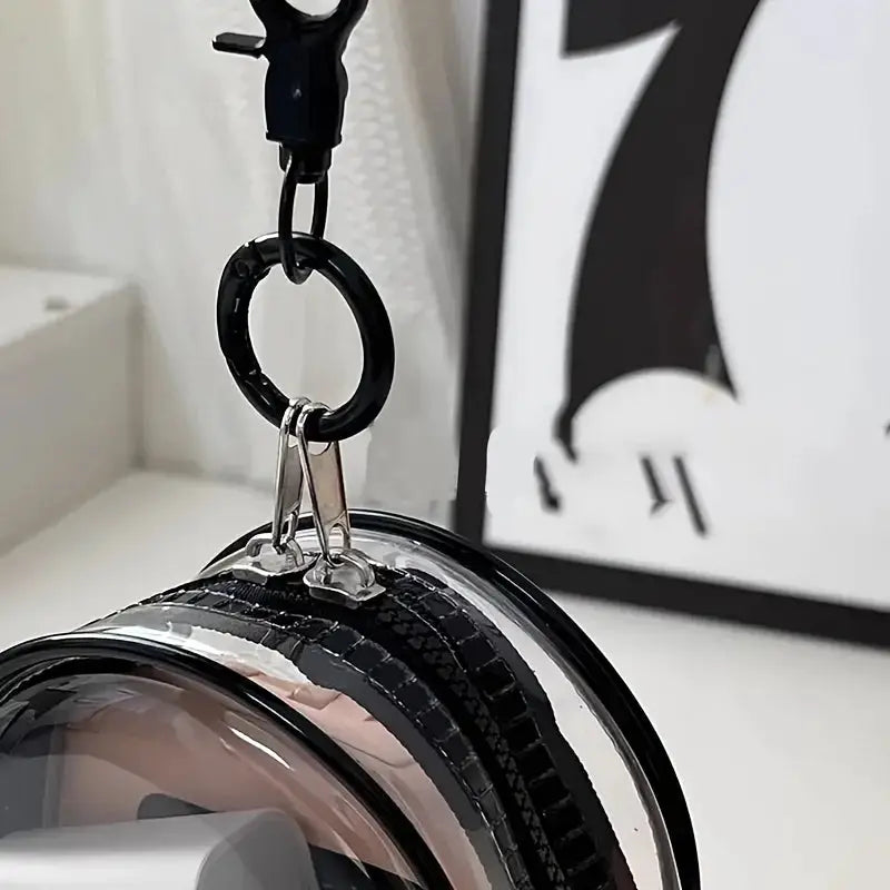 Portable mini clear zipper storage bag by Simples Market; transparent round pouch for earphones & chargers with a keychain loop.