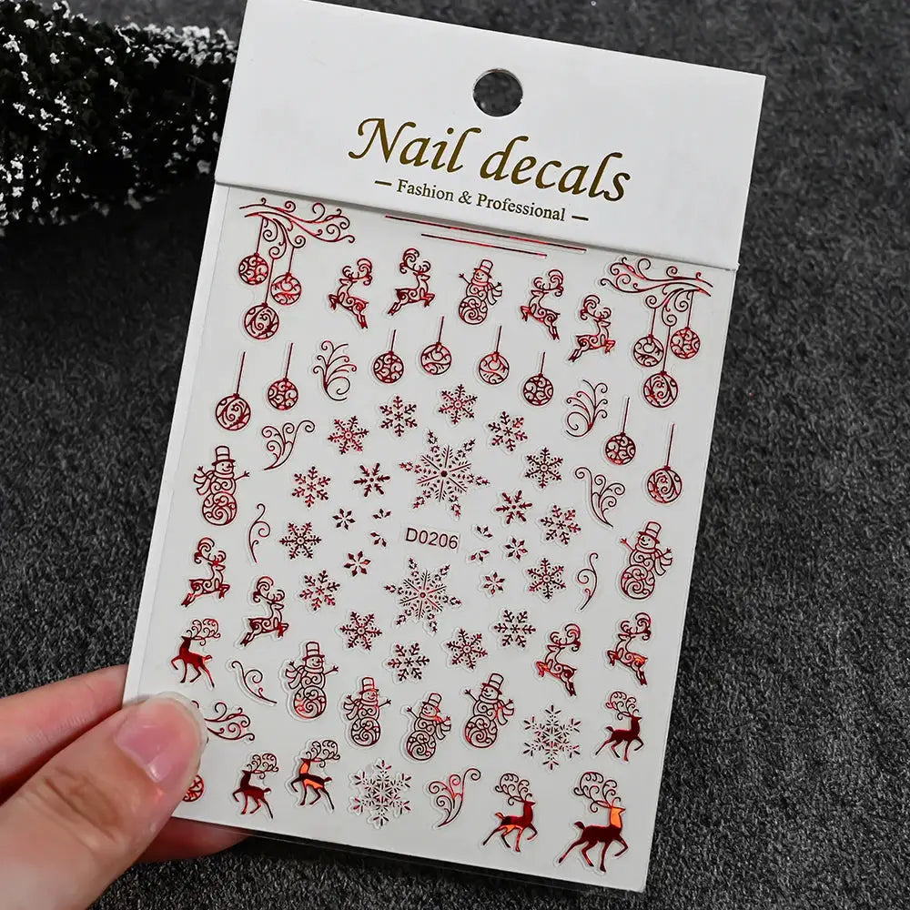 Nail decal sheet with red winter designs featuring snowmen, snowflakes and reindeer, self-adhesive