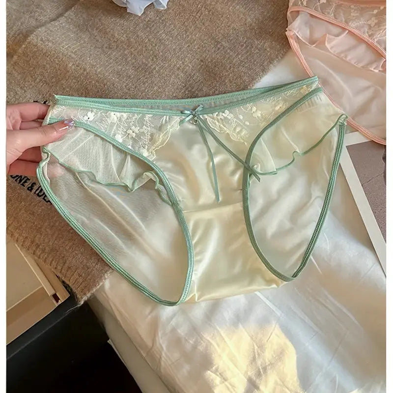 Women's lace mesh satin panties with mint green trim, ruffle edge, low-rise, breathable; pink pair visible