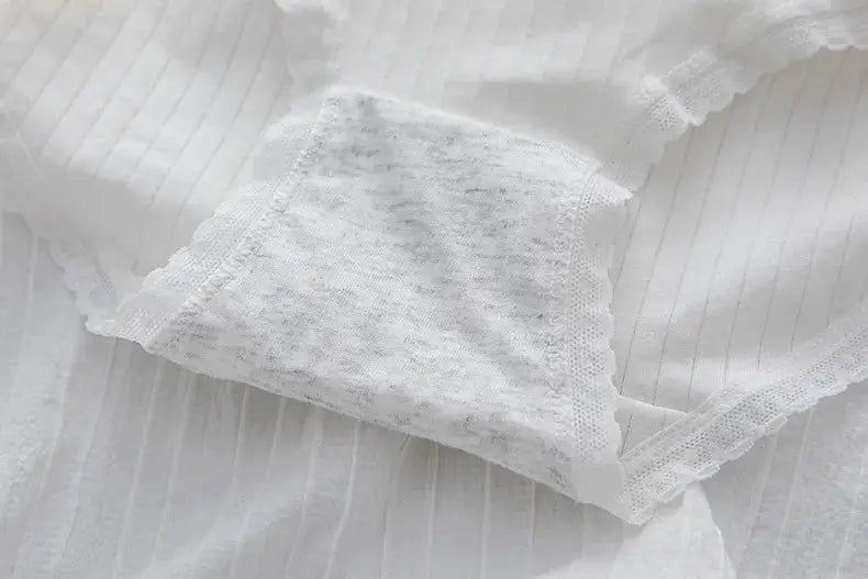 White cotton women's underwear briefs with lace trim, breathable underpants.