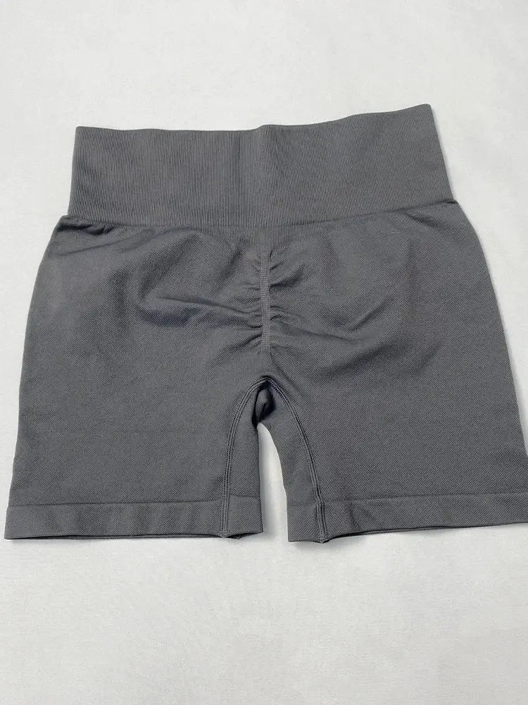 Women's yoga shorts, gray, high-waisted with a wide ribbed waistband and back center seam.