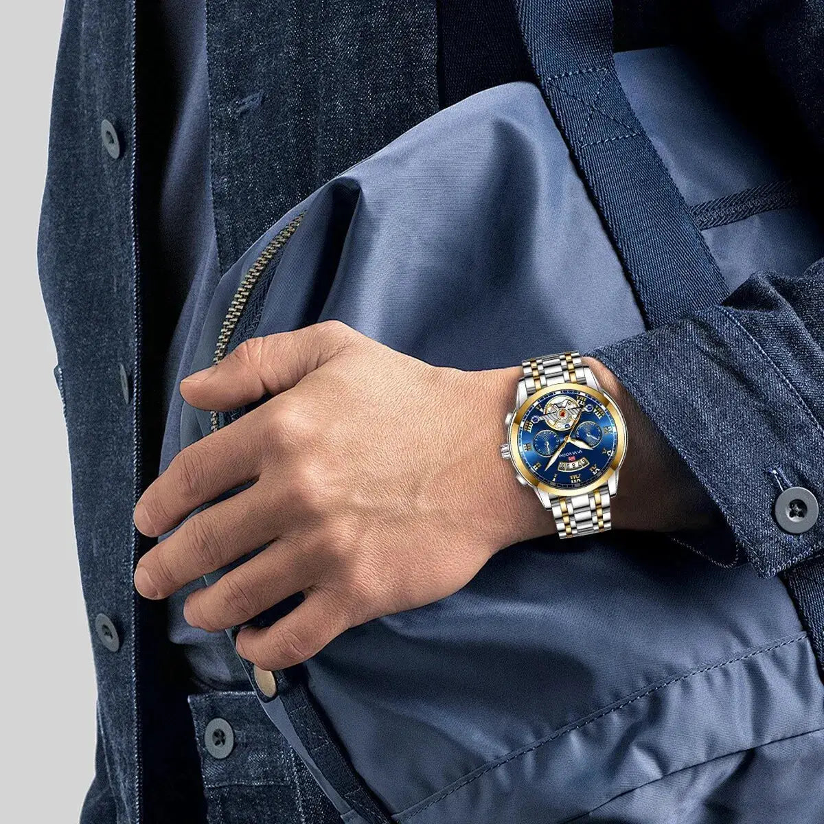 Men's luxury wristwatch by Simples Market with stainless steel two-tone band and blue dial with luminescent markers