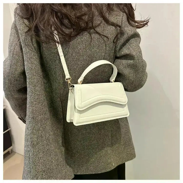 Simples Market white PU leather handbag with top handle and crossbody strap