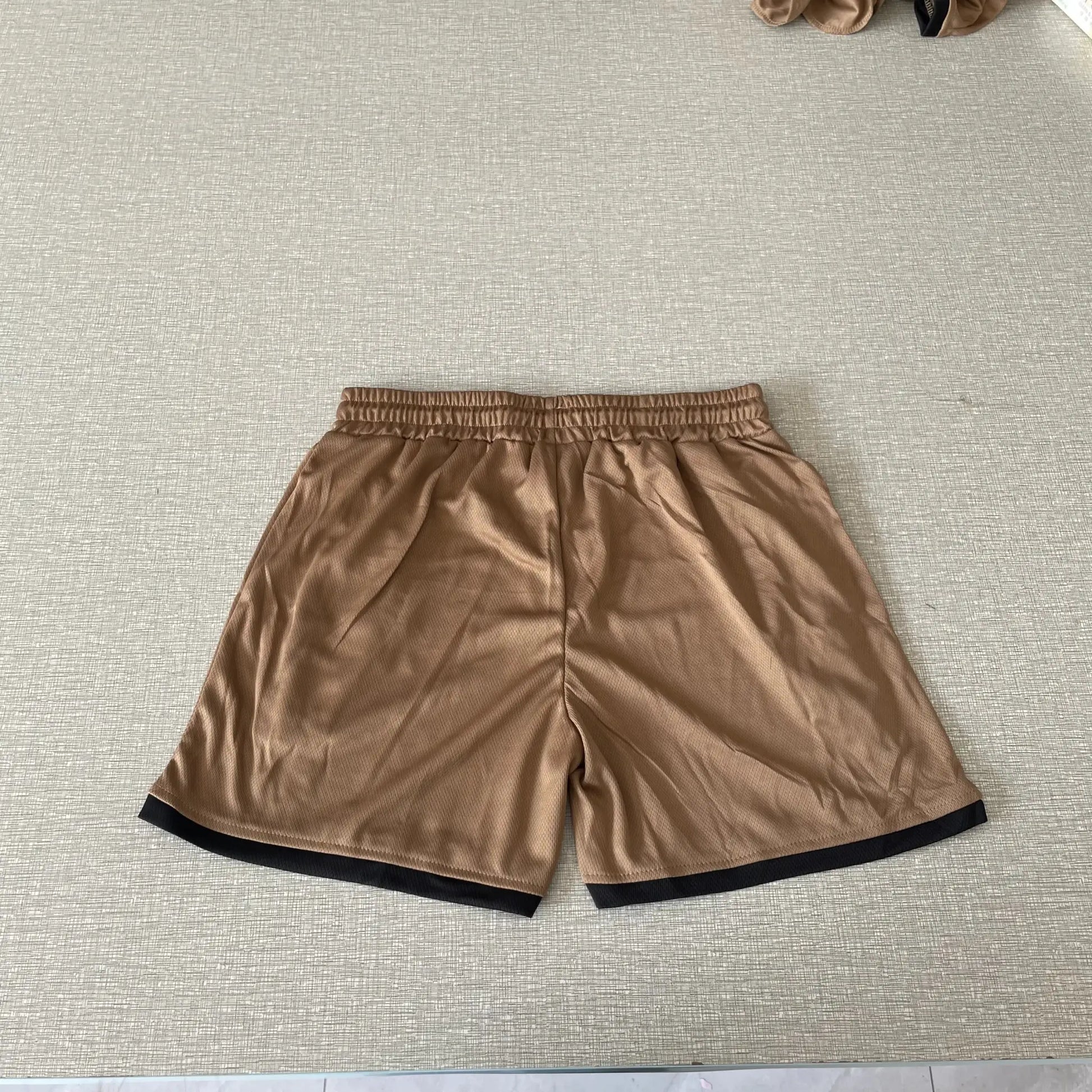 Simples Market men's brown mesh sports shorts for gym, basketball and beach workouts.