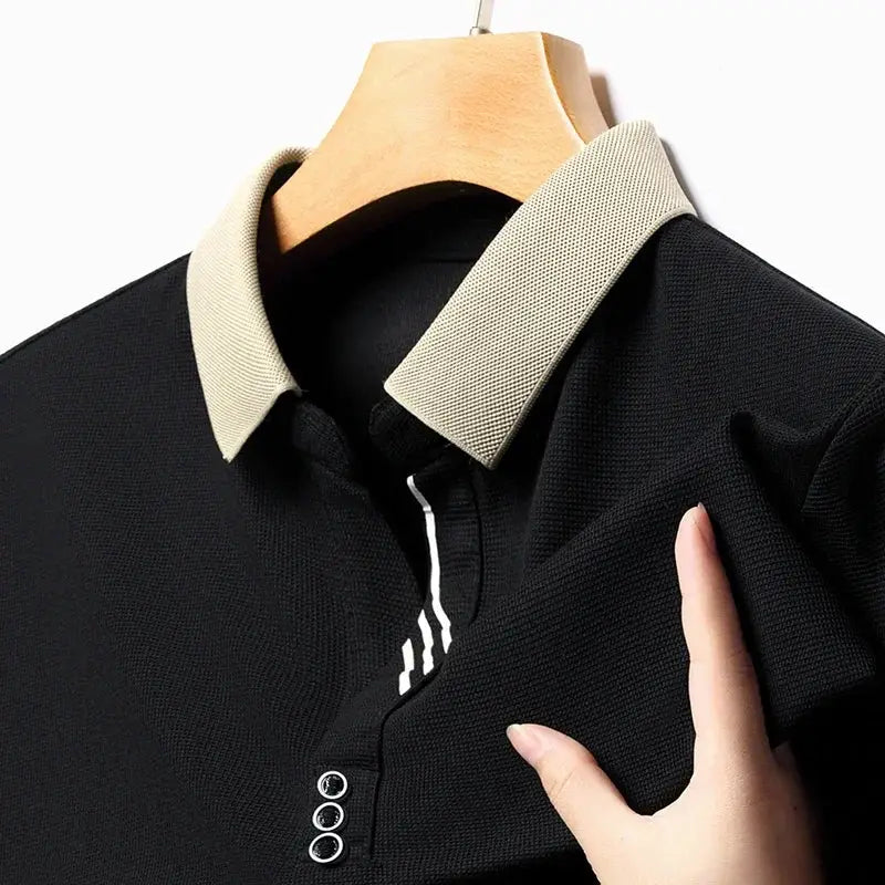 Men's polo shirt by Simples Market; black solid color with beige collar, short sleeves.