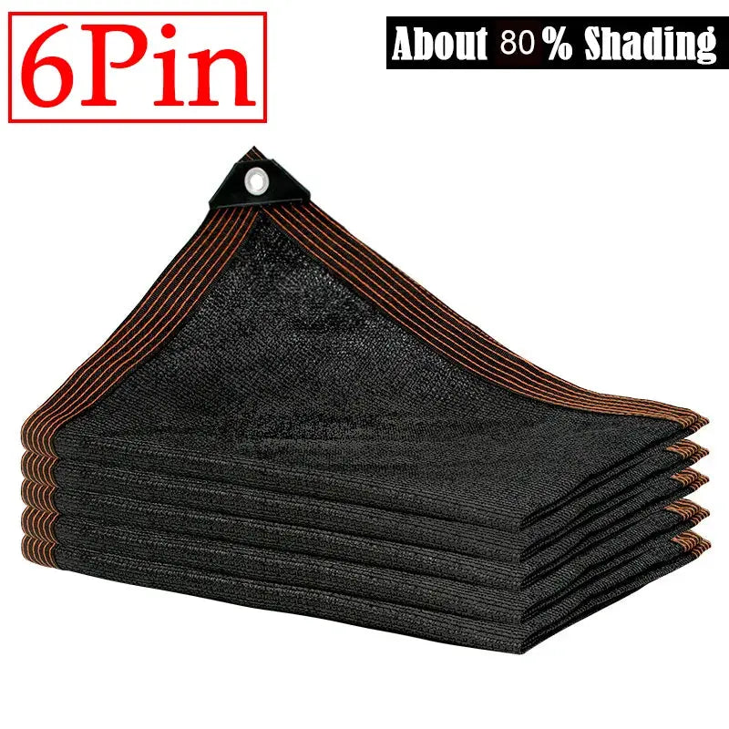 6x6m black shade cloth panels by 6Pin with orange-stitched edges and grommets, stacked for outdoor use.
