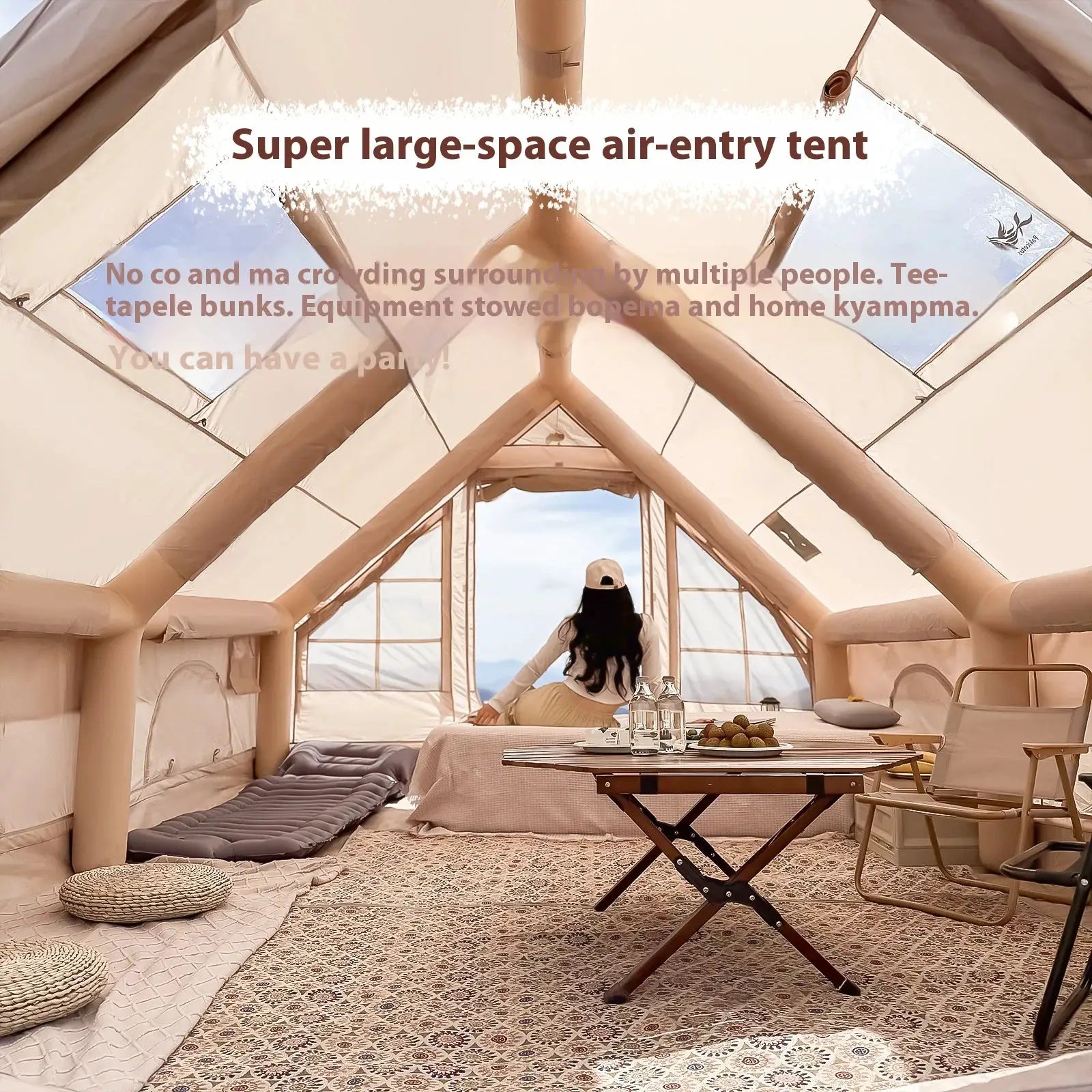 Simples Market inflatable luxury camping tent interior in beige with lounge seating and dining table.