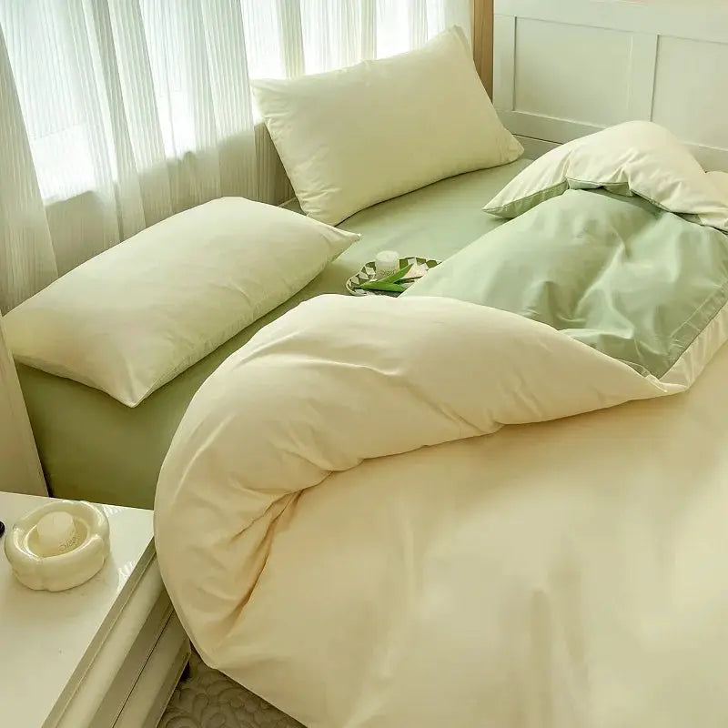 4-piece brush-fabric bed set with two-tone cream and sage green duvet cover, bed sheet, and pillowcases
