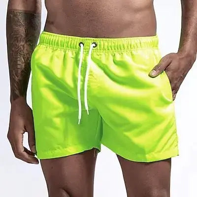 Swim trunks for men by Simples Market in neon lime with white drawstring and pockets