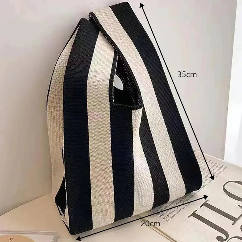 Fashionable hand-woven handbag with black and white vertical stripes, 20x35 cm.