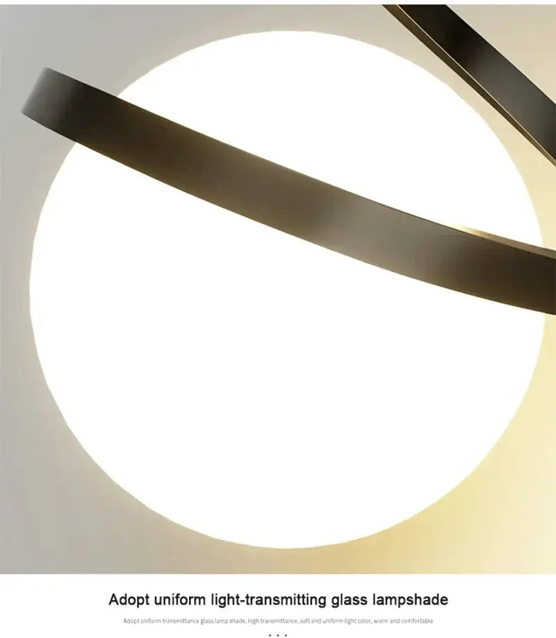 Nordic LED pendant light by Simples Market with glowing circular glass shade and dark metal band