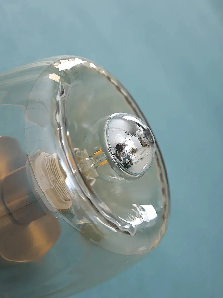 LED Bauhaus glass wall lamp with clear glass shade and chrome socket.