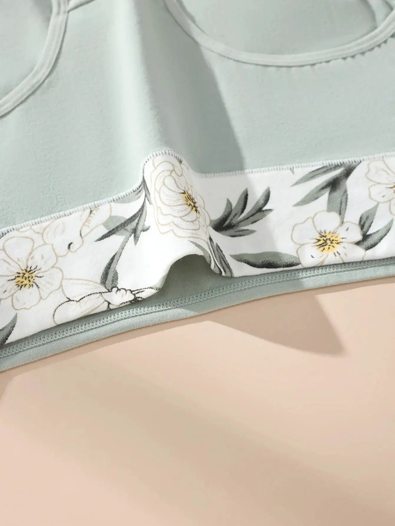 Women's high-waist cotton briefs in mint green with a white floral panel