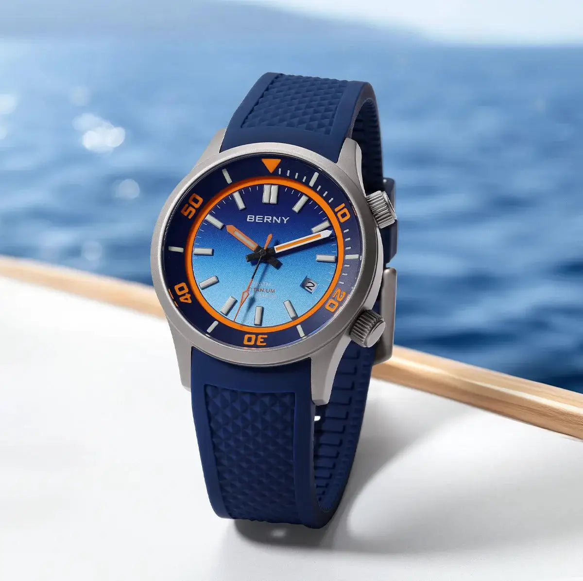 BERNY 20ATM diver watch with blue gradient dial, orange bezel, and blue silicone strap