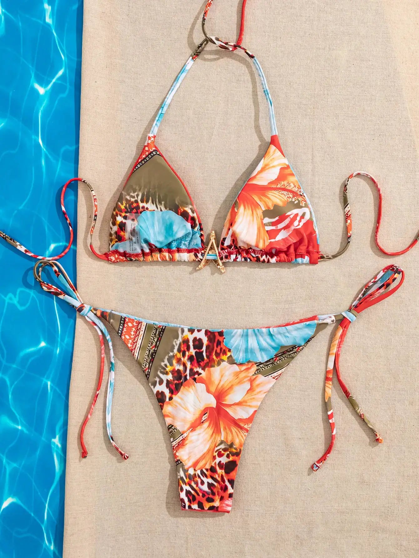 Two-piece bikini set with colorful floral print, triangle top and adjustable tie sides