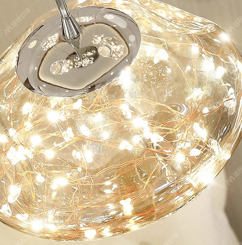 Simples Market glass globe pendant light with warm white LED string lights for living room