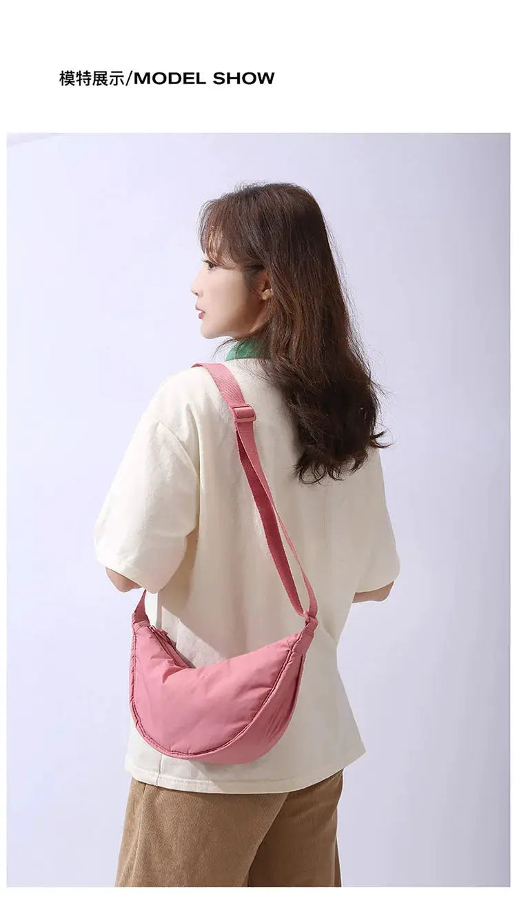 Women's pink nylon padded crossbody bag with adjustable strap