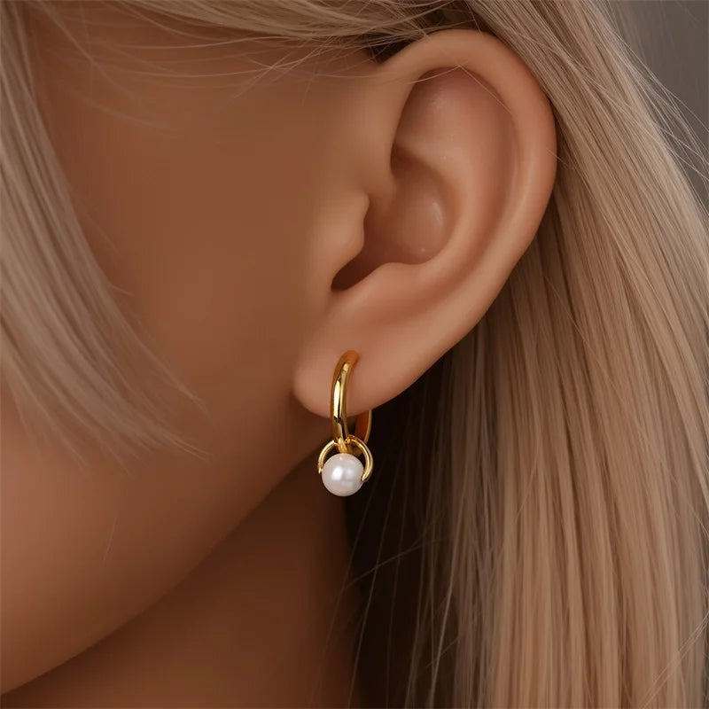 Gold-tone hoop earrings with a pearl drop for women