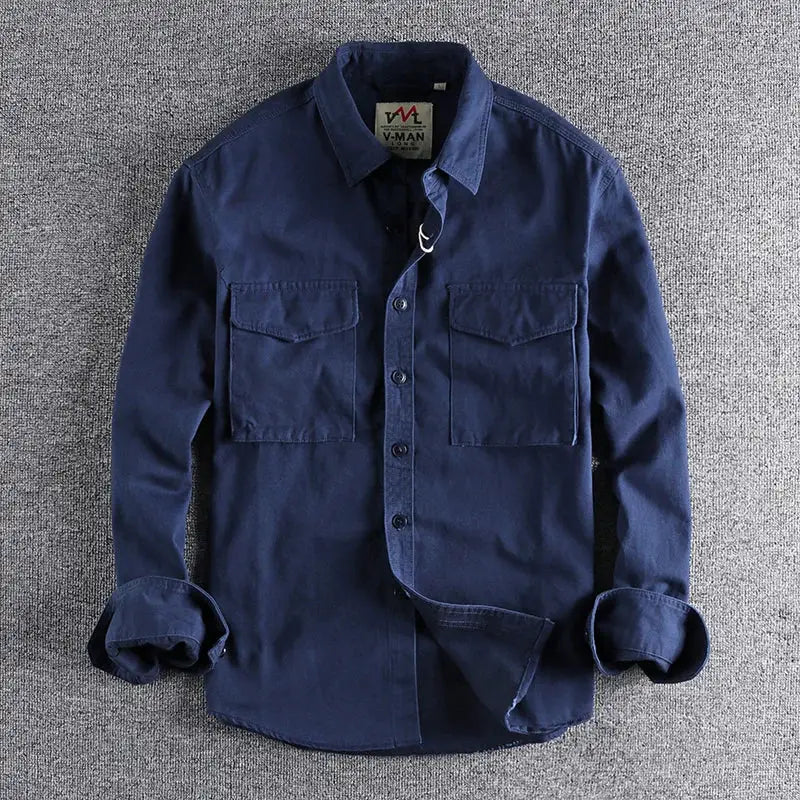Navy blue work shirt jacket with two chest pockets, button front, V-Man tag