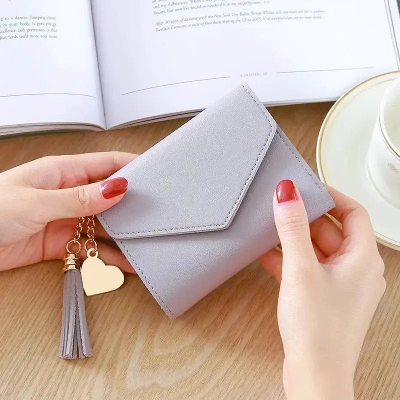 Simples Market PU leather wallet with tassel and heart charm, lavender-gray compact card holder.
