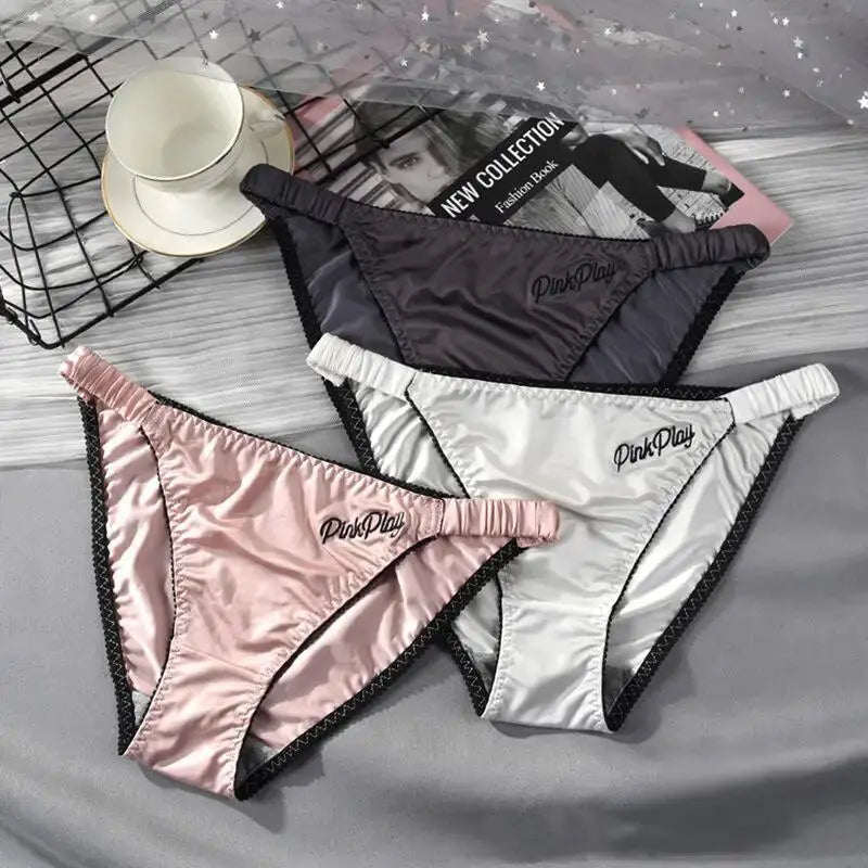 PinkPlay satin panties 3-pack in black, pink, and white with embroidered lettering and elastic waistbands
