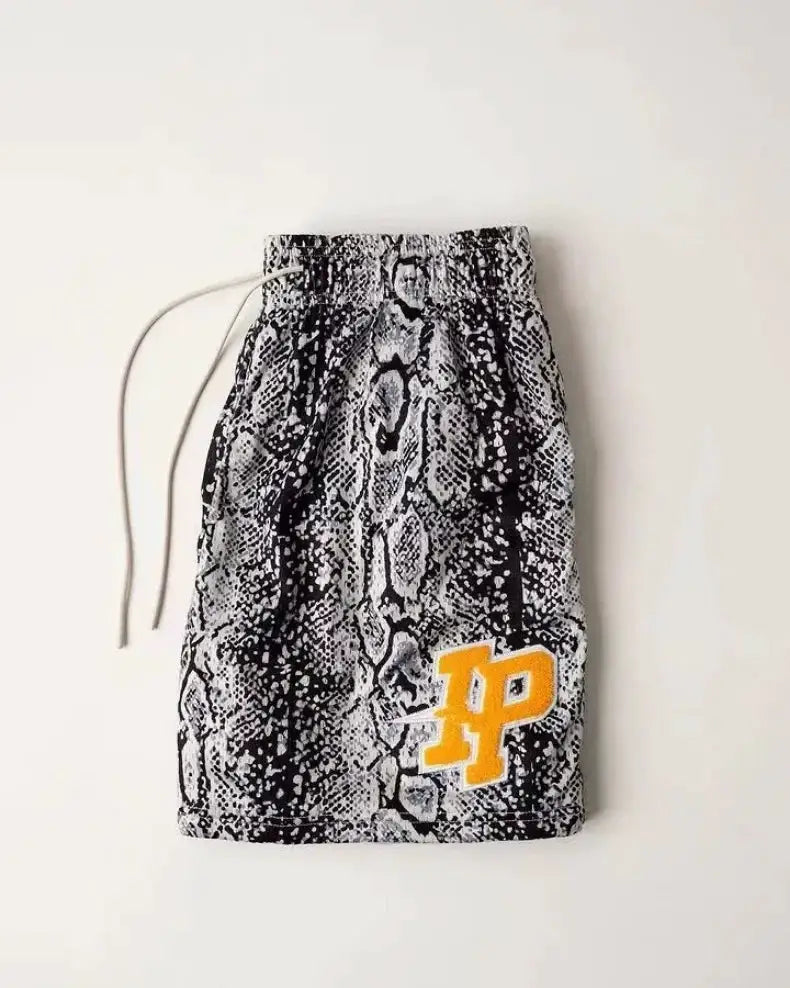 Men's snake-print shorts with drawstring waist and yellow logo on the leg