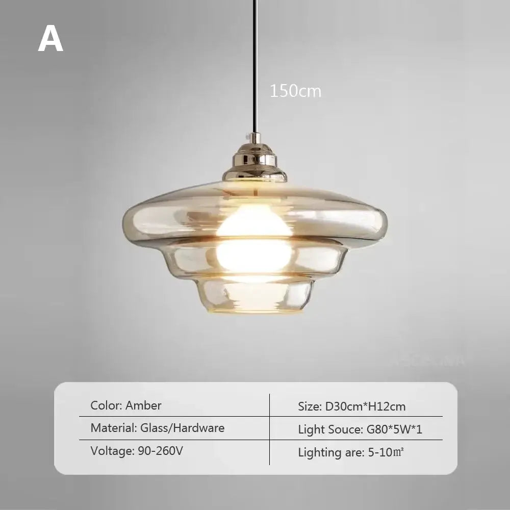 Nordic glass pendant lamp amber glass shade by Simples Market for modern dining room lighting.