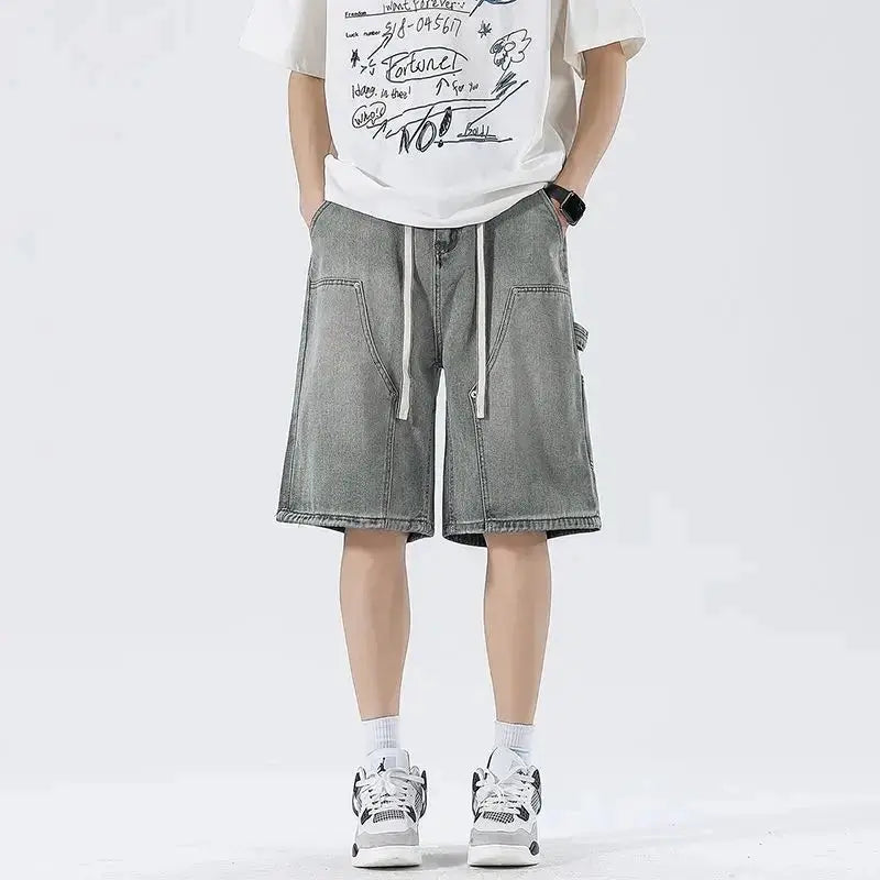 Men's denim shorts, loose knee-length with cargo pockets and white drawstrings in washed gray-blue denim