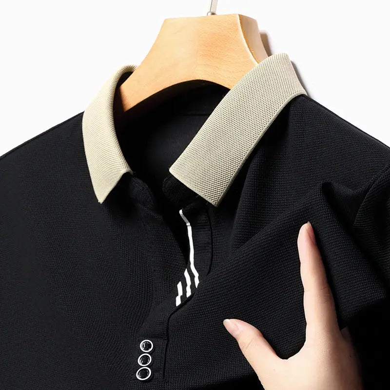 Men's polo shirt, black with beige collar, short sleeves and three-button placket.