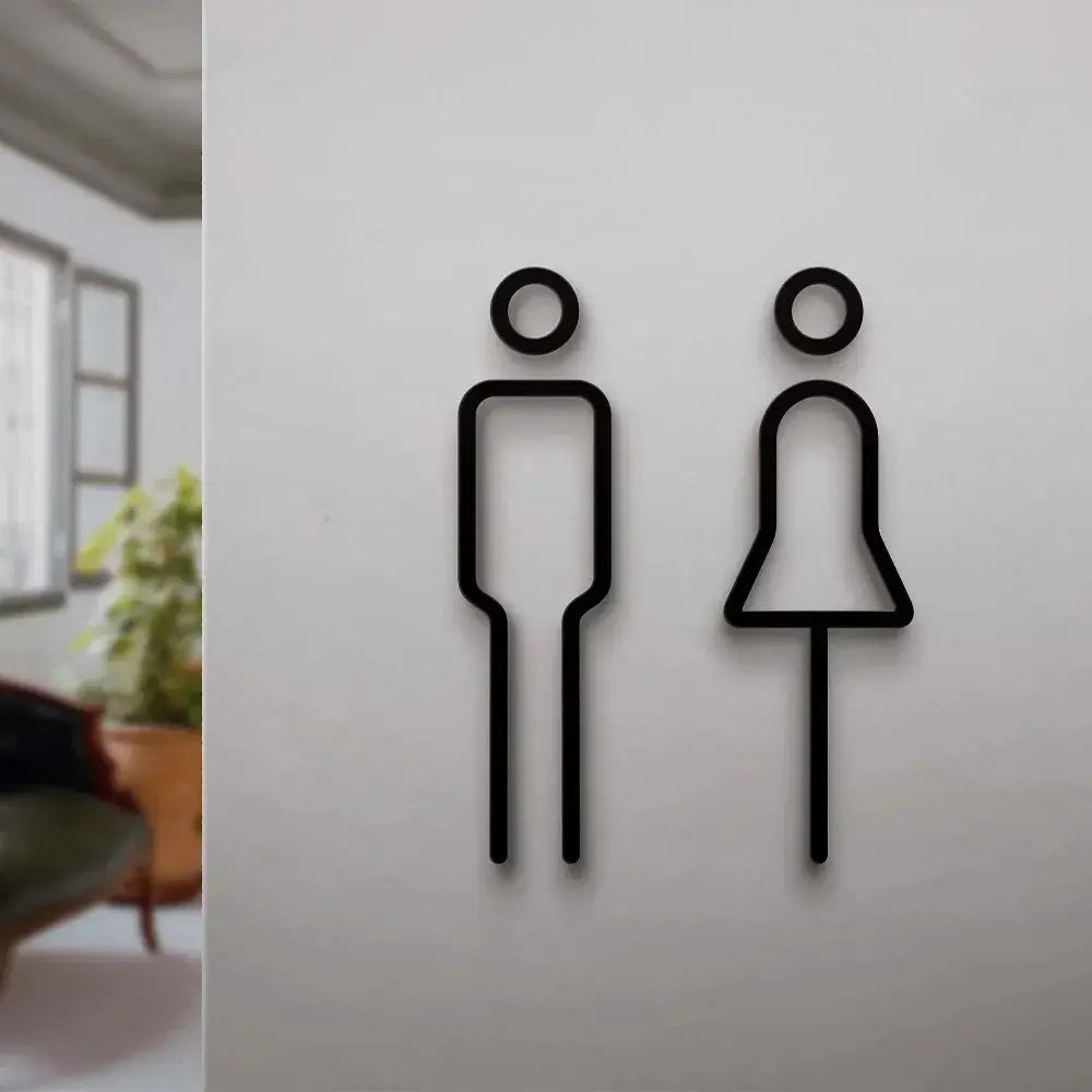 2-piece 3D black restroom door signs for wall decor, male and female figures.