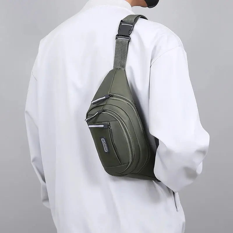 Waist bag by Simples Market, olive green with multiple zip pockets and crossbody strap.