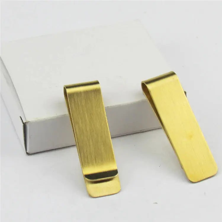 Gold-tone brushed money clips, set of 2, on a white box