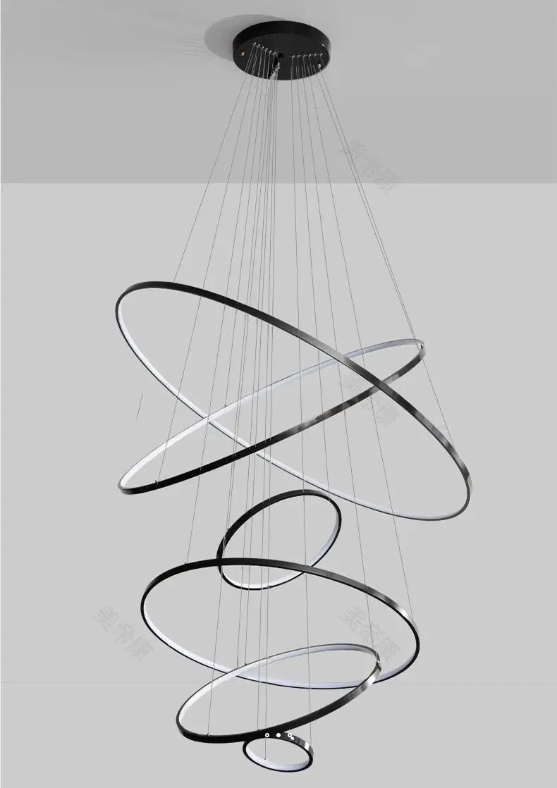 LED pendant light chandelier with spiraling circular rings, black metal finish, for staircase, by Simples Market