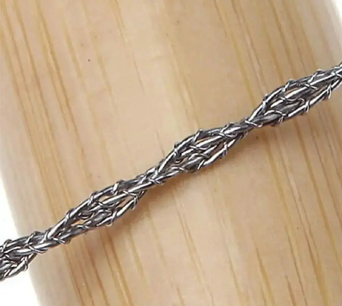 Portable survival chain saw wire rope, braided steel, silver, close-up