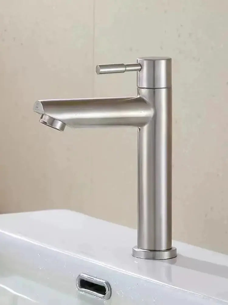 Stainless steel deck-mounted single basin tap with tall cylindrical body and small horizontal lever.